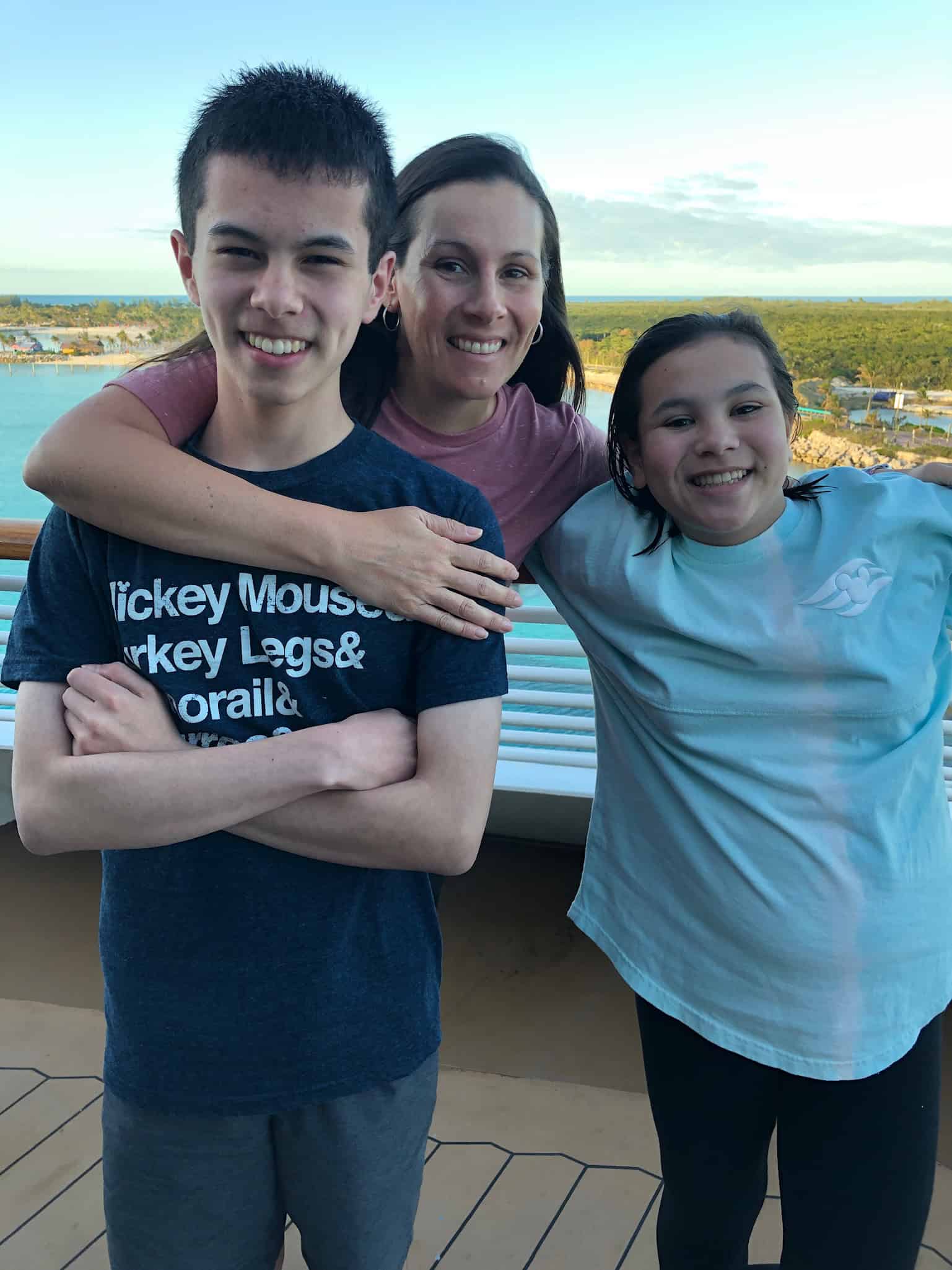Family together on a bridge wearing tee shirts